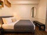 Bedroom with bed and bedside lighting — Cozy Luxury in the Plateau