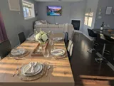 Dining table and chairs — Modern 1BR with Desk Near YUL