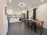 Kitchen and dining area beside the windows — Modern 3BR Spacious Home