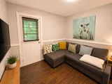 Living room with sofa and television — Luxury 2BR in the Plateau