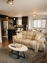 Living area opening onto the kitchen — Modern 1BR with Private Bath