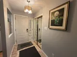 Entry hall with mirrored closet — Stylish Getaway 3BR with Heated Pool