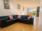 Living room with sofa and television — Spacious 2BR Holiday Home Near YUL