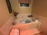 Bathroom with corner bathtub — Stylish Getaway 3BR with Heated Pool