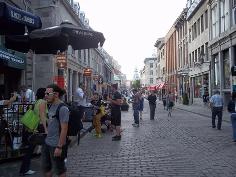 Historic buildings and restaurant terraces along rue Saint-Paul in Old Montreal