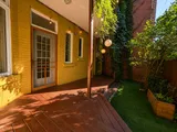 Garden patio table for outdoor meals — Cozy Heritage 2BR with Lush Private Garden Patio