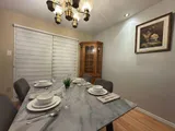 Dining table and chairs — Stylish Getaway 3BR with Heated Pool