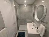 Bathroom with enclosed shower — Cozy Studio Near YUL