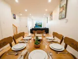 Dining table and chairs — Spacious 2BR Holiday Home Near YUL