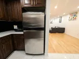 Full-size refrigerator — Spacious 2BR Holiday Home Near YUL