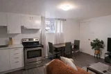 Kitchen and dining table — Rehoboth 1BR in Laval