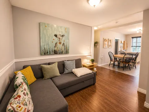 Living area opening onto the kitchen — Luxury 2BR in the Plateau
