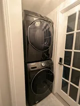 Stacked washer and dryer — Cozy Studio Near YUL