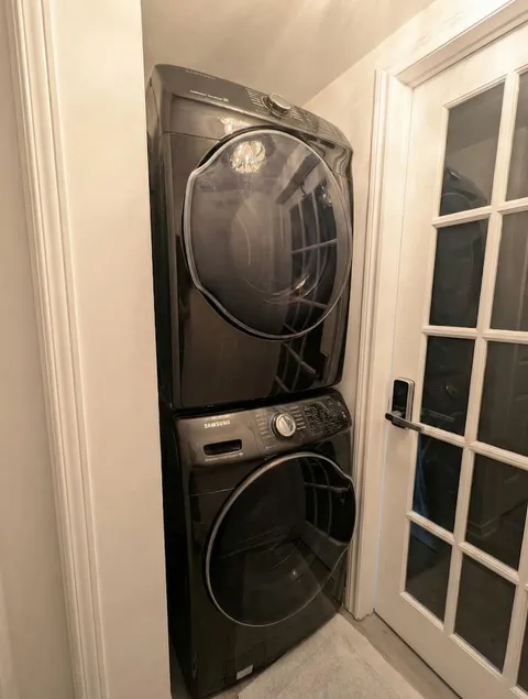 Stacked washer and dryer — Cozy Studio Near YUL