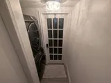 Entry corridor beside the laundry area — Cozy Studio Near YUL