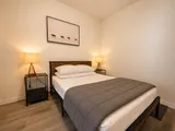 Bedroom with bed and bedside lighting — Cozy Luxury in the Plateau