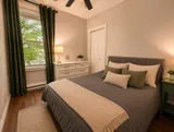 Bedroom with window and bedside tables — Luxury 2BR in the Plateau