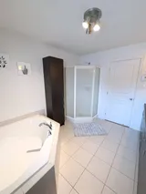 Bathroom with enclosed shower — Modern 1BR with Private Bath