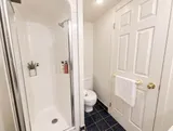 Second bathroom with enclosed shower — Bright 2BR Retreat