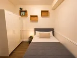 Bedroom with bed and bedside lighting — Cozy Luxury in the Plateau