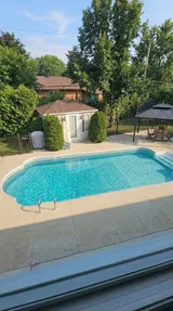 Outdoor swimming pool and backyard — Stylish Getaway 3BR with Heated Pool