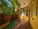 Private patio surrounded by greenery — Cozy Heritage 2BR with Lush Private Garden Patio