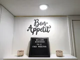 Kitchen decor and welcome sign — Stylish Modern 1BR with EV Charger
