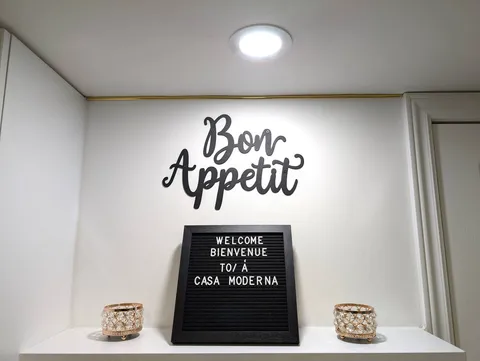 Kitchen decor and welcome sign — Stylish Modern 1BR with EV Charger