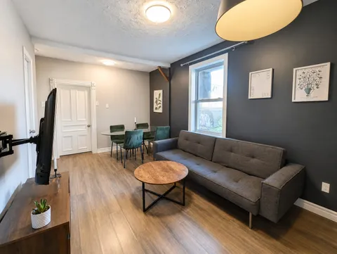 Living room — New Luxury 4BR Plateau Stay