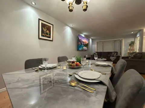 Dining table and chairs — Stylish Getaway 3BR with Heated Pool