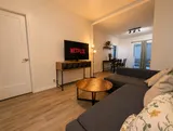 Living room with sofa and television — Cozy Luxury in the Plateau