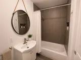 Bathtub with shower — Luxury 2BR in the Plateau