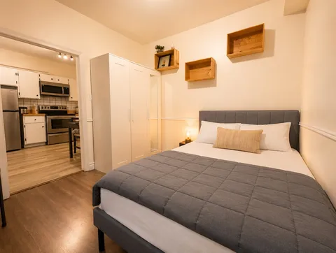 Bedroom opening toward the kitchen — Cozy Luxury in the Plateau