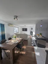 Dining table and chairs — Modern 1BR with Private Bath