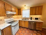 Kitchen with stove and refrigerator — Stylish Getaway 3BR with Heated Pool