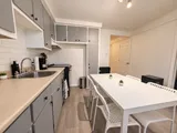 Kitchen with drip coffee maker, sink and oven — Cozy 2-Bedroom Retreat