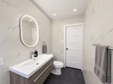 Bathroom vanity, toilet and entrance — Modern 3BR Spacious Home