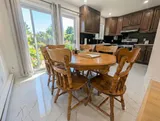 Kitchen and dining table — Spacious 2BR Holiday Home Near YUL