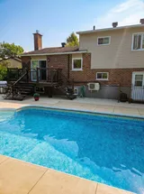 Outdoor swimming pool and backyard — Stylish Getaway 3BR with Heated Pool