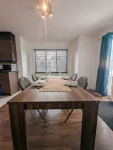 Dining table and chairs — Modern 1BR with Private Bath