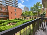 Garden view from the private balcony — Bright 2BR Retreat