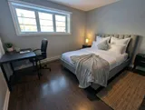 Bedroom with dedicated desk and chair — Modern 1BR with Desk Near YUL