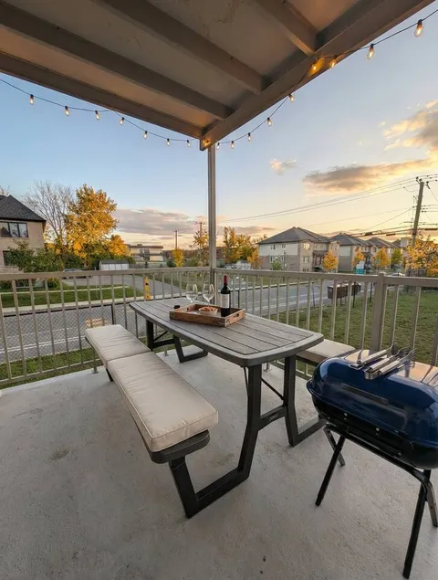 Covered outdoor dining area — Modern 1BR with Private Bath