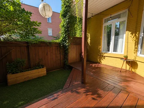 Lush private garden patio with outdoor dining — Cozy Heritage 2BR with Lush Private Garden Patio
