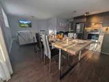 Dining table and chairs — Modern 1BR with Desk Near YUL