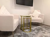 TV seating area with armchairs — Stylish Modern 1BR with EV Charger