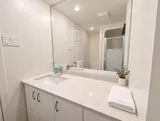 Spacious vanity in the second bathroom — Bright 2BR Retreat