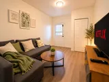Living room with sofa and television — Cozy Luxury in the Plateau