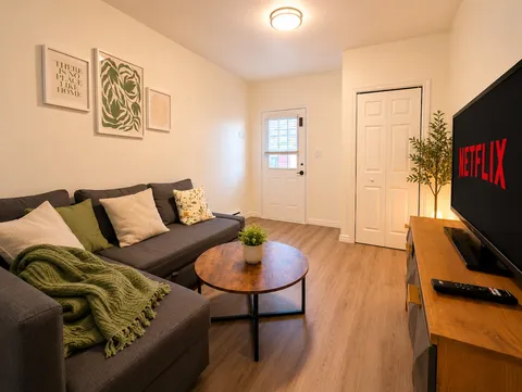 Living room with sofa and television — Cozy Luxury in the Plateau