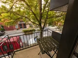 Balcony overlooking the street — Luxury 2BR in the Plateau